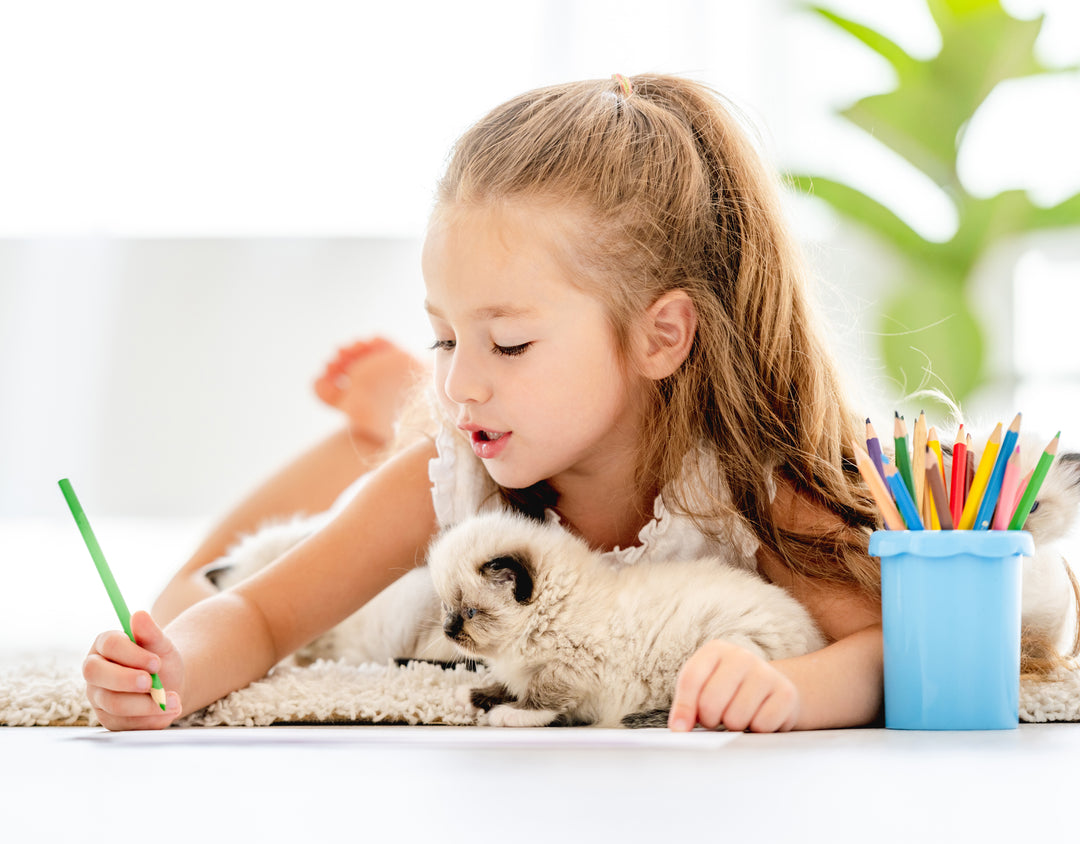 girl painting with her pet