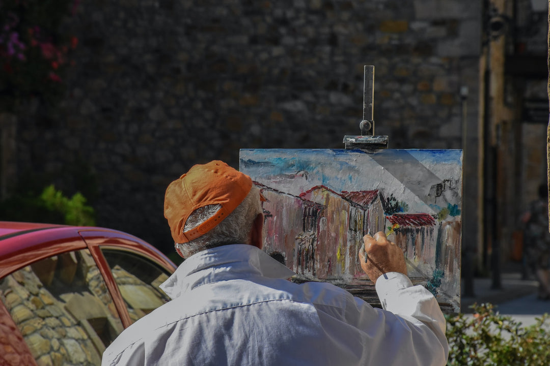 man working on a painting