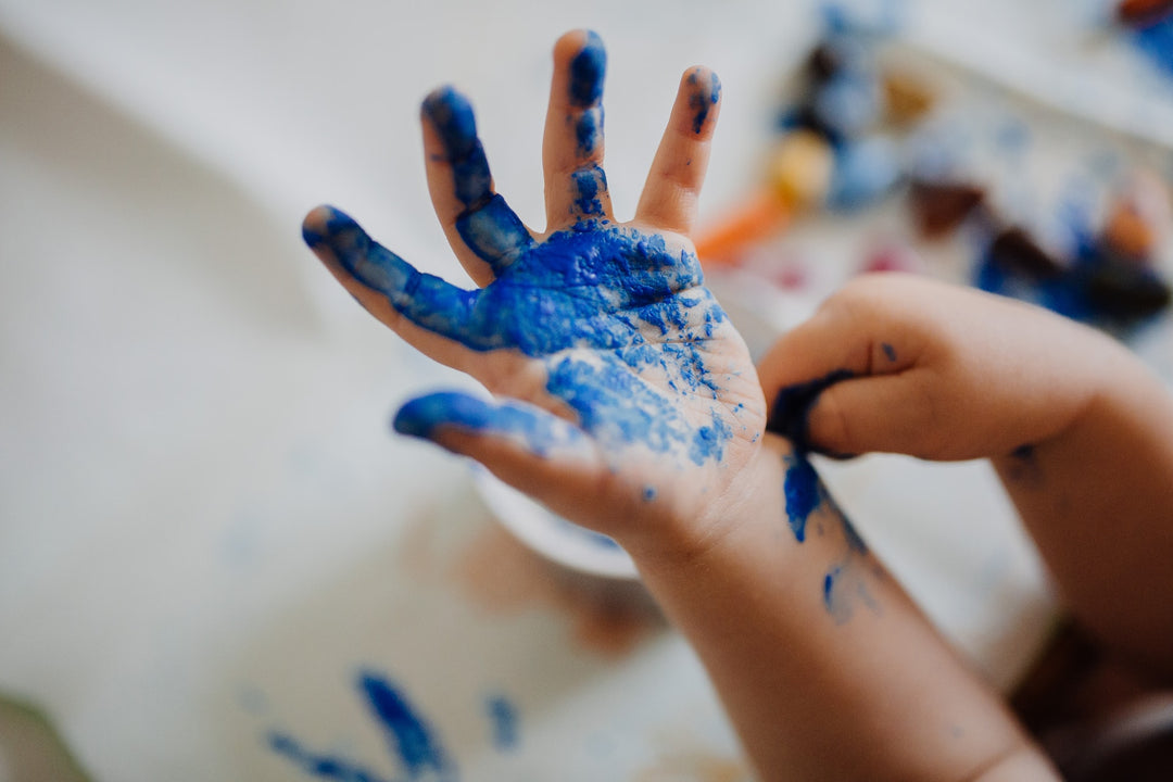 kid's hand with paint