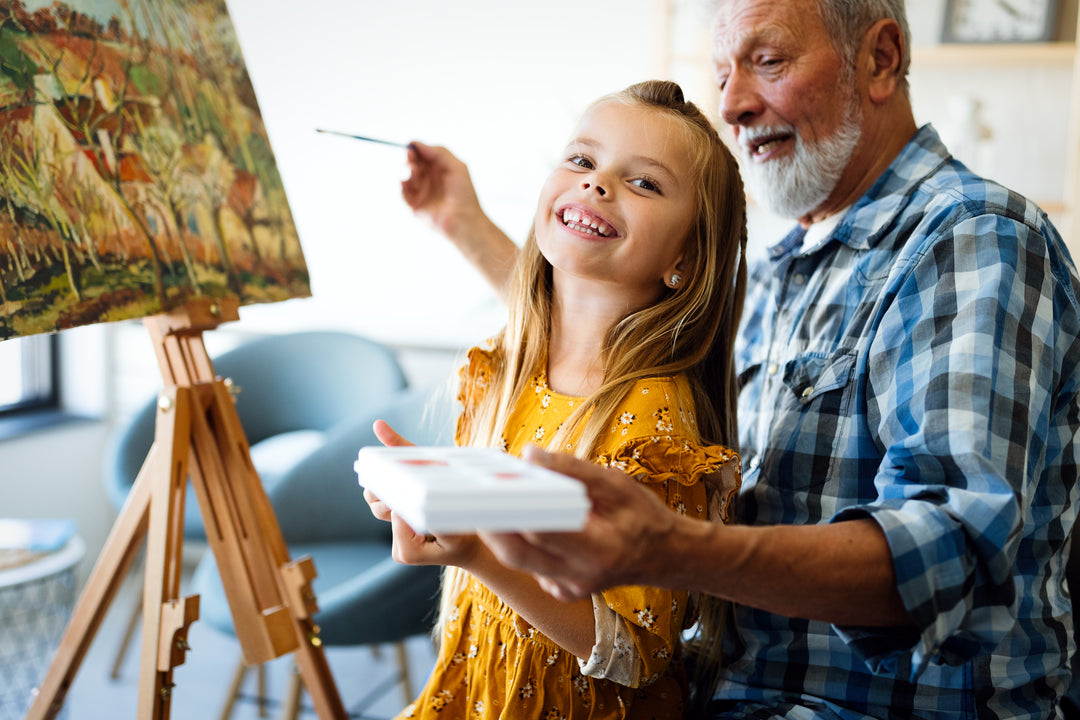 Grandpa and Granddaughter painting together