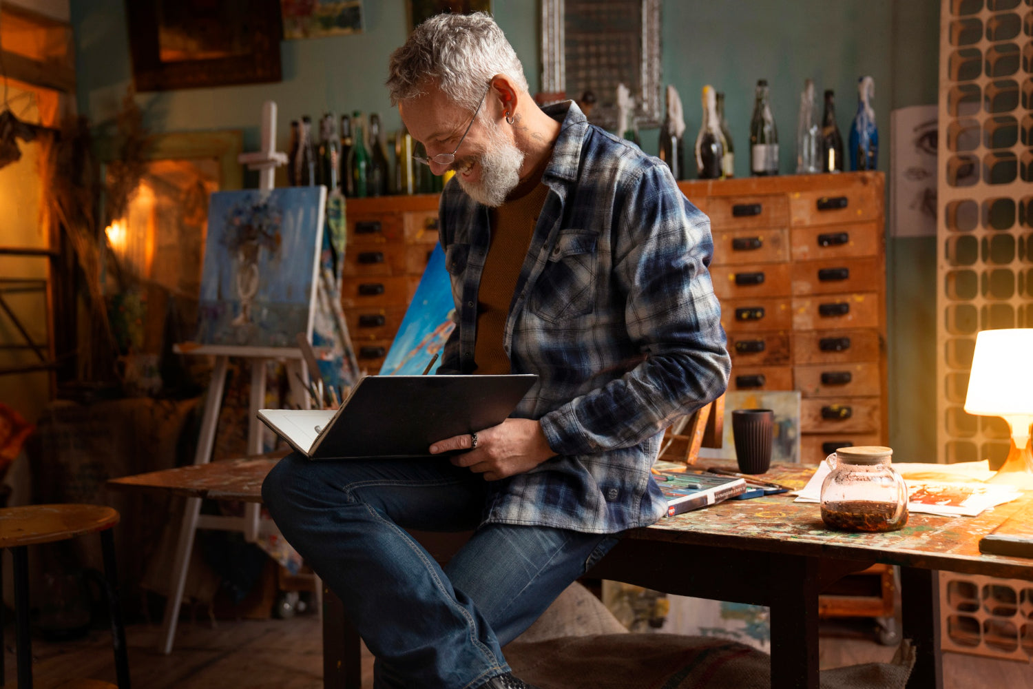 man with drawing notebook