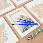 Artistic setup with paint tubes and brushes on a wooden surface