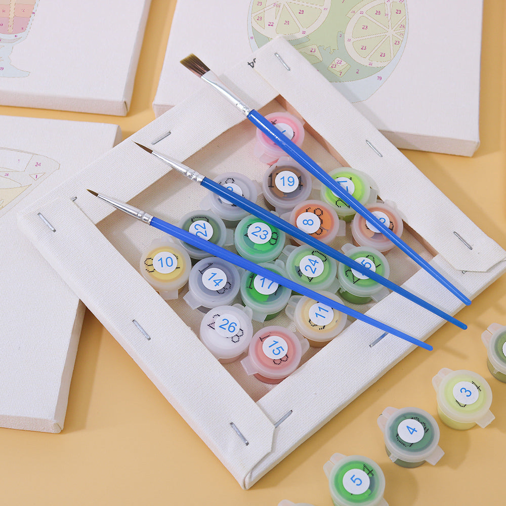 Finished mini canvas showing a colorful martini glass with fruit garnish