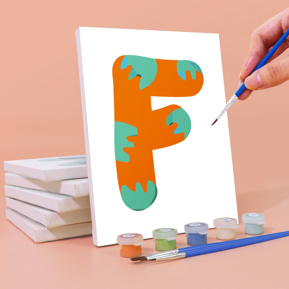 Person painting a letter 'F' on a canvas with paint supplies.