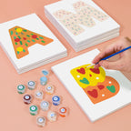 Children's art activity set with paint and canvas on a peach background