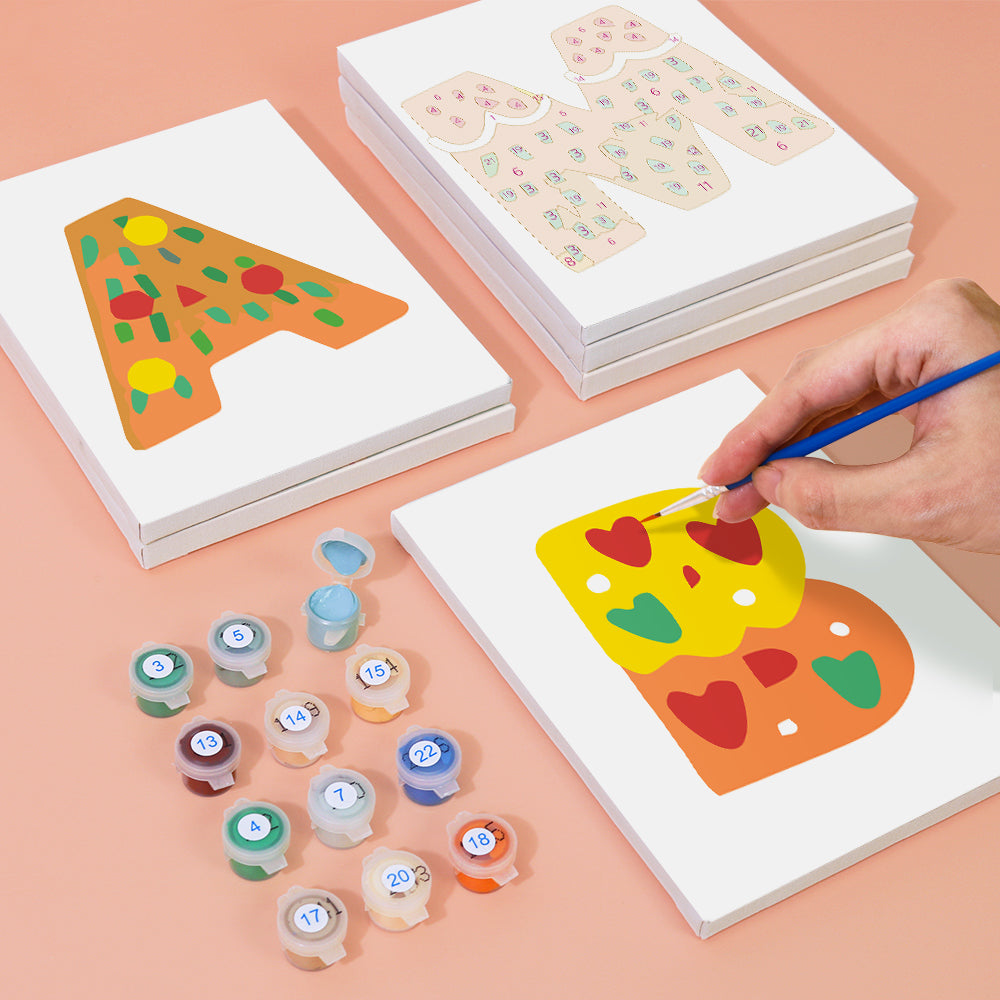 Children's art activity set with paint and canvas on a peach background