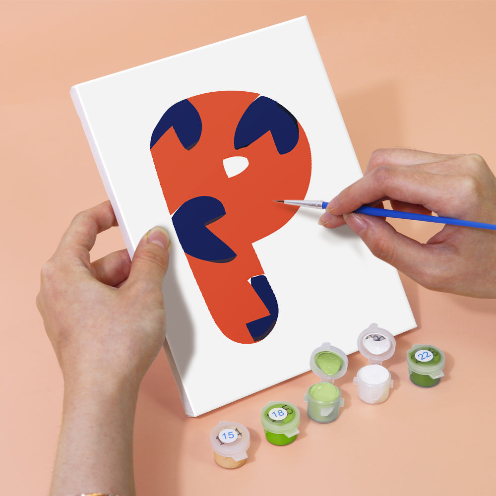 Person painting a colorful abstract design on a white canvas with paint containers below.