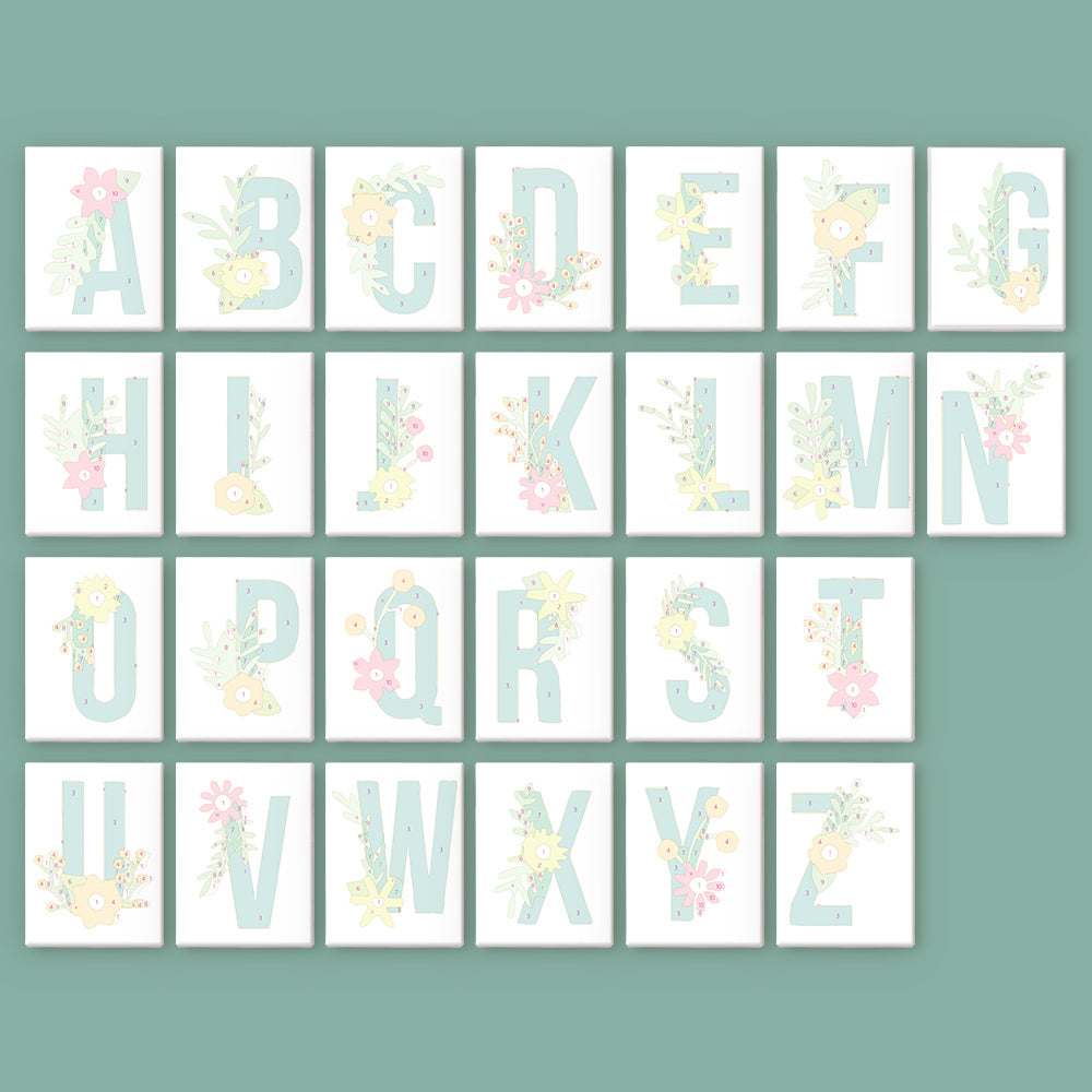Alphabet letters with floral designs on a green background