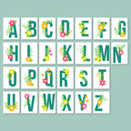 Alphabet letters with floral designs on a light blue background