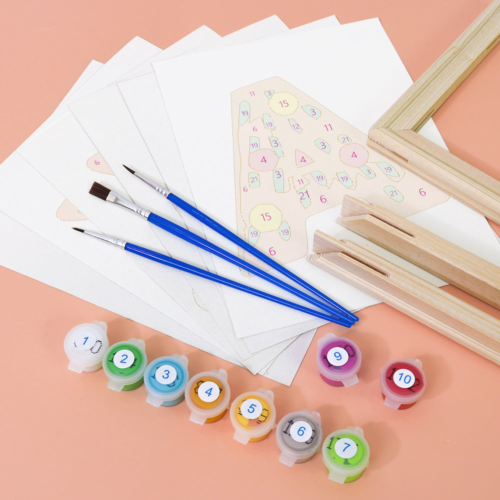 Art supplies including brushes, paint containers, and a wooden frame on a peach background