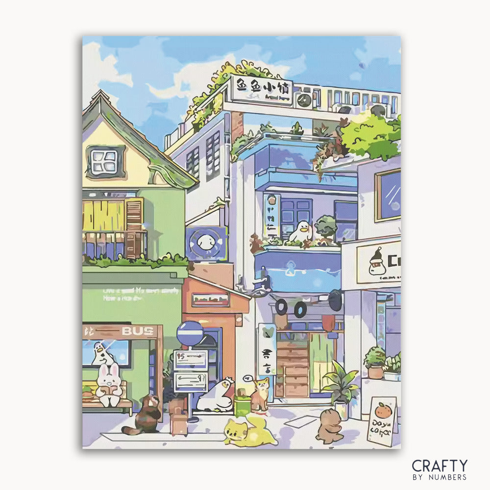 A paint-by-numbers kit depicting a vibrant scene with various buildings and a character sitting at a table, labeled 'CRAFTY by Numbers'.