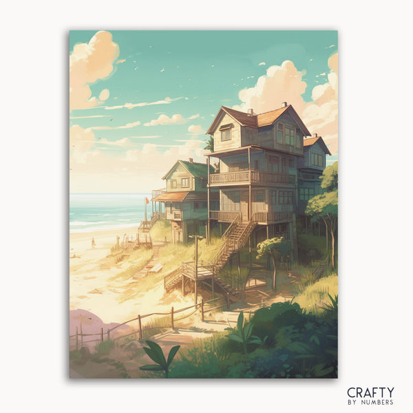 A paint-by-numbers kit image featuring a beach house scene with a staircase leading to the ocean, with a clear sky and greenery in the foreground.