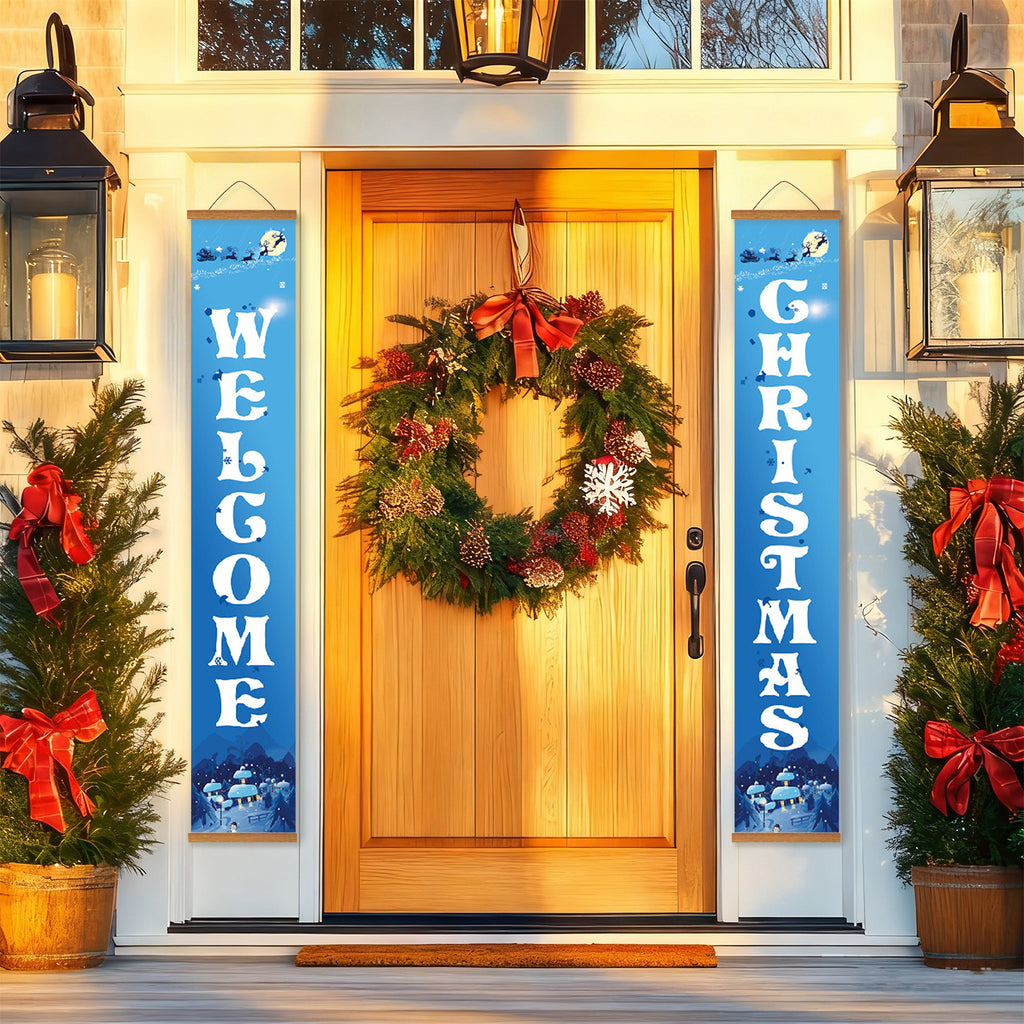 Corona navideña decorativa en una puerta con carteles de "Bienvenido" y "Navidad" que la flanquean.