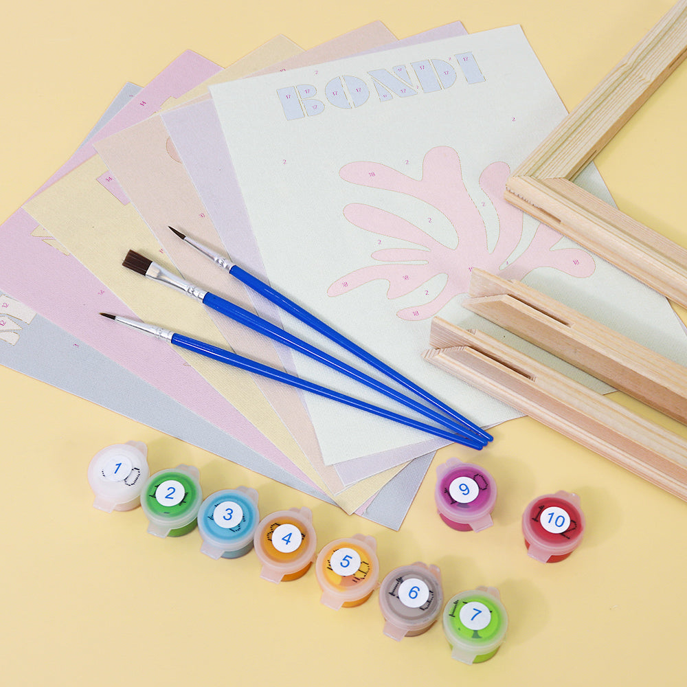 Mini Escapes kit with mountain scenery on a wooden table