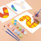 Child painting a number on paper with paint and brushes on a table