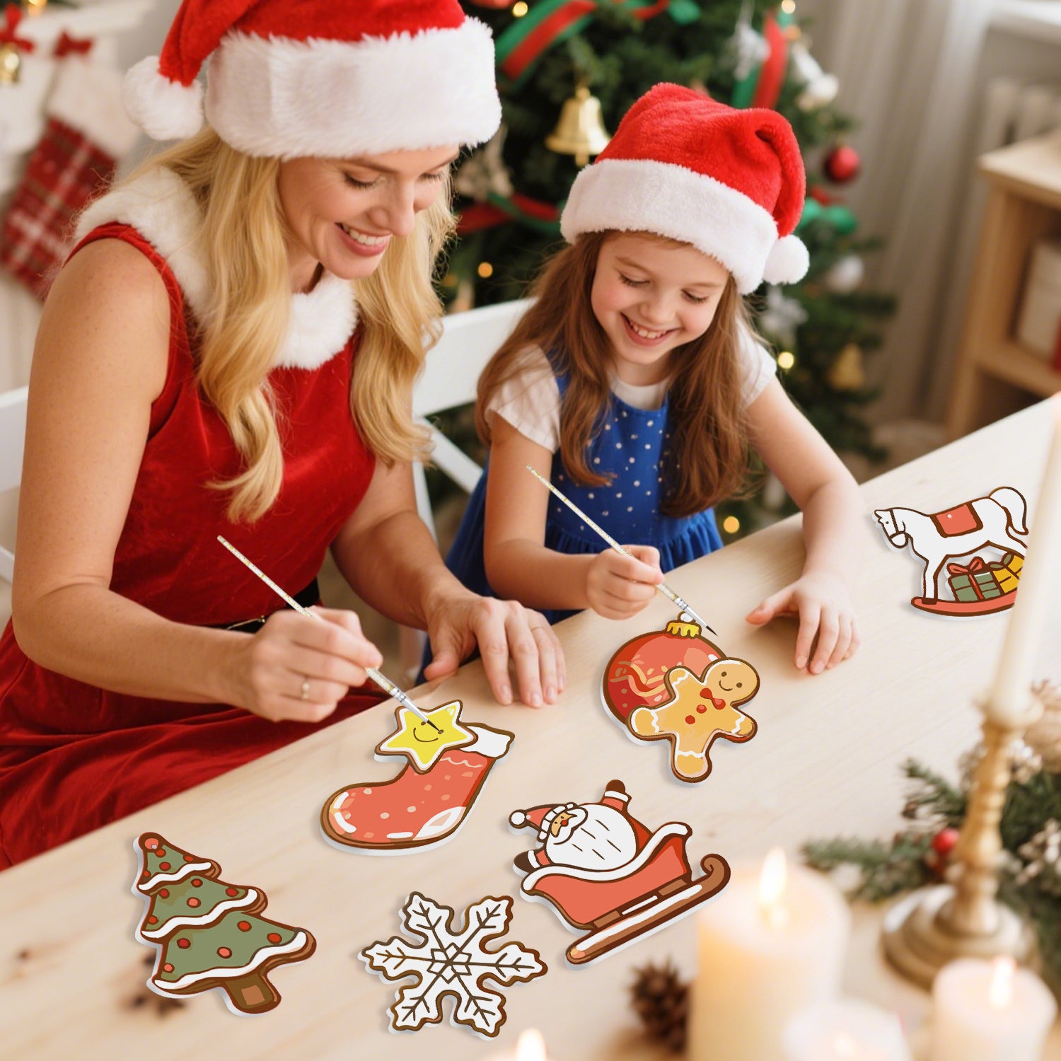 Femme et jeune fille portant des chapeaux de Père Noël peignant des découpes de papier sur le thème de Noël dans un cadre festif.