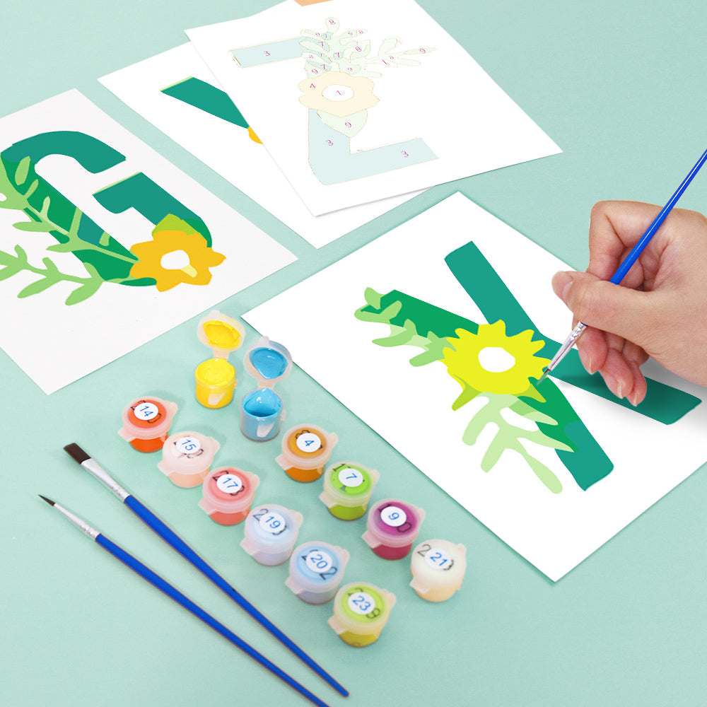 Children painting letters on paper with paint and brushes on a light green background