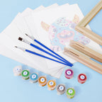 Paintbrushes, paint containers, and a framed picture on a light blue background
