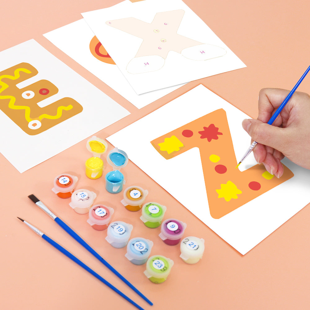 Child painting a letter 'Z' on a piece of paper with colorful paint and brushes.