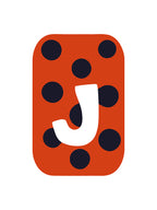 Letter 'J' on a red background with black polka dots