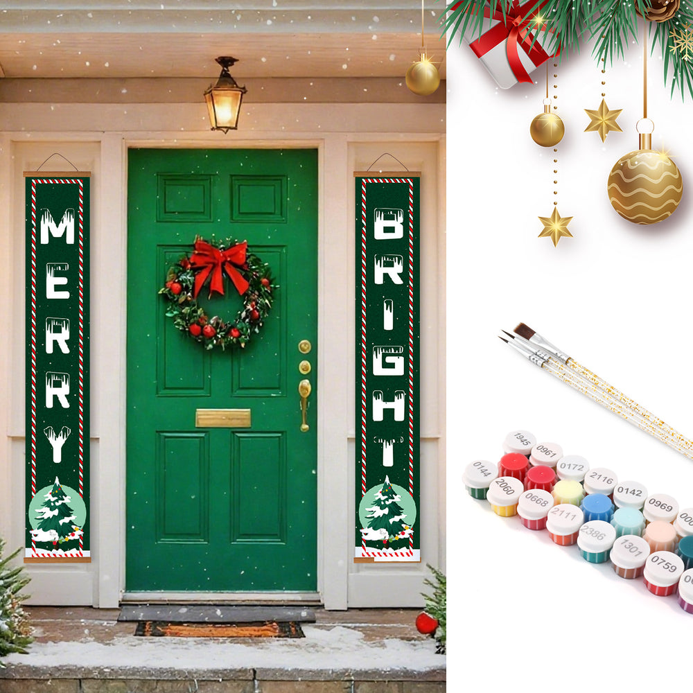 Decorative Christmas banners on a green door with festive decorations and paint supplies.