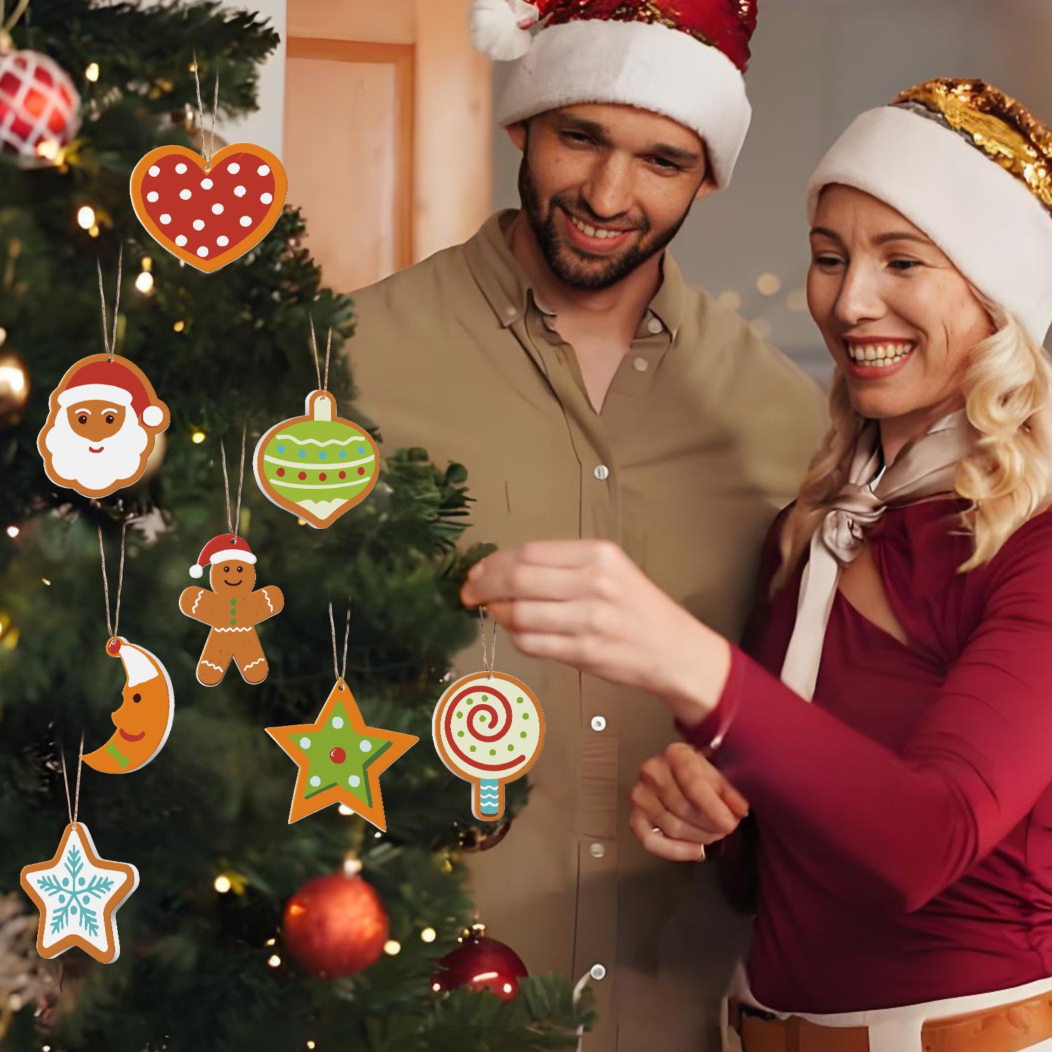 Homme et femme décorant un sapin de Noël avec des ornements colorés.