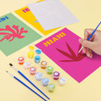 Person enjoying painting a Mini Escapes kit at home