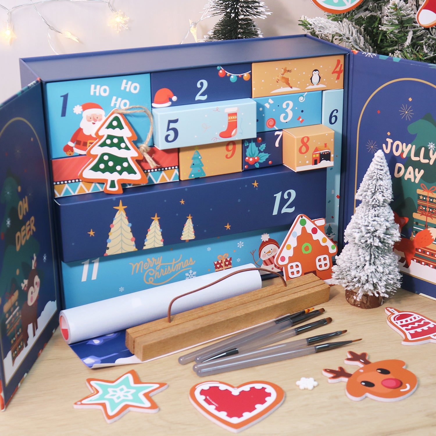 Advent calendar with festive designs and Christmas decorations on a wooden surface.