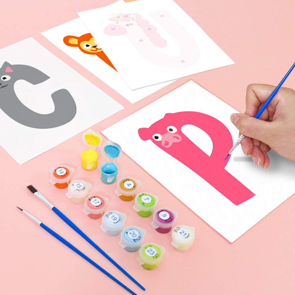 Child painting a letter 'P' on a pink sheet with art supplies on a pink background