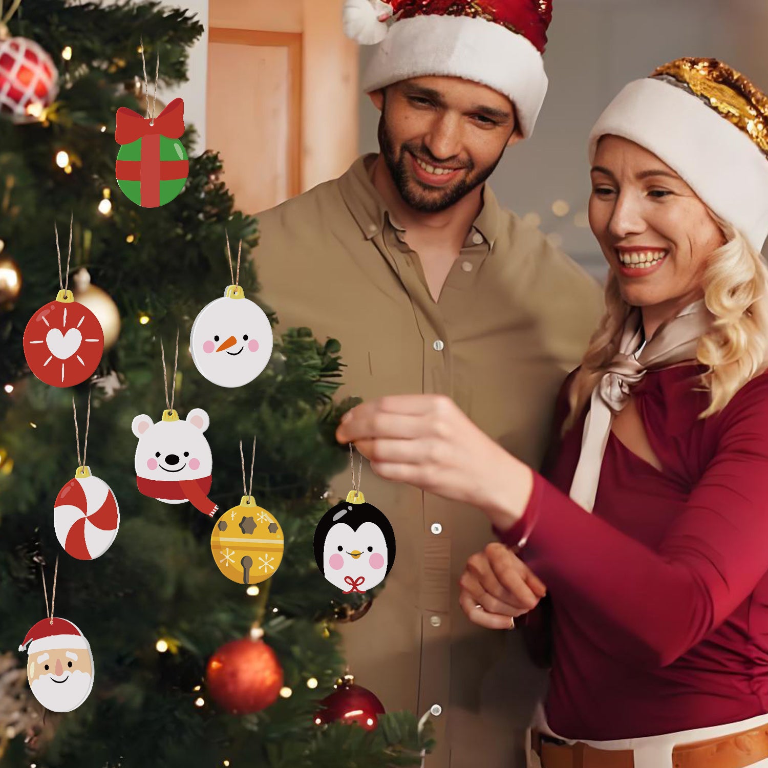 Man and woman in festive hats standing next to a Christmas tree with decorative ornaments.