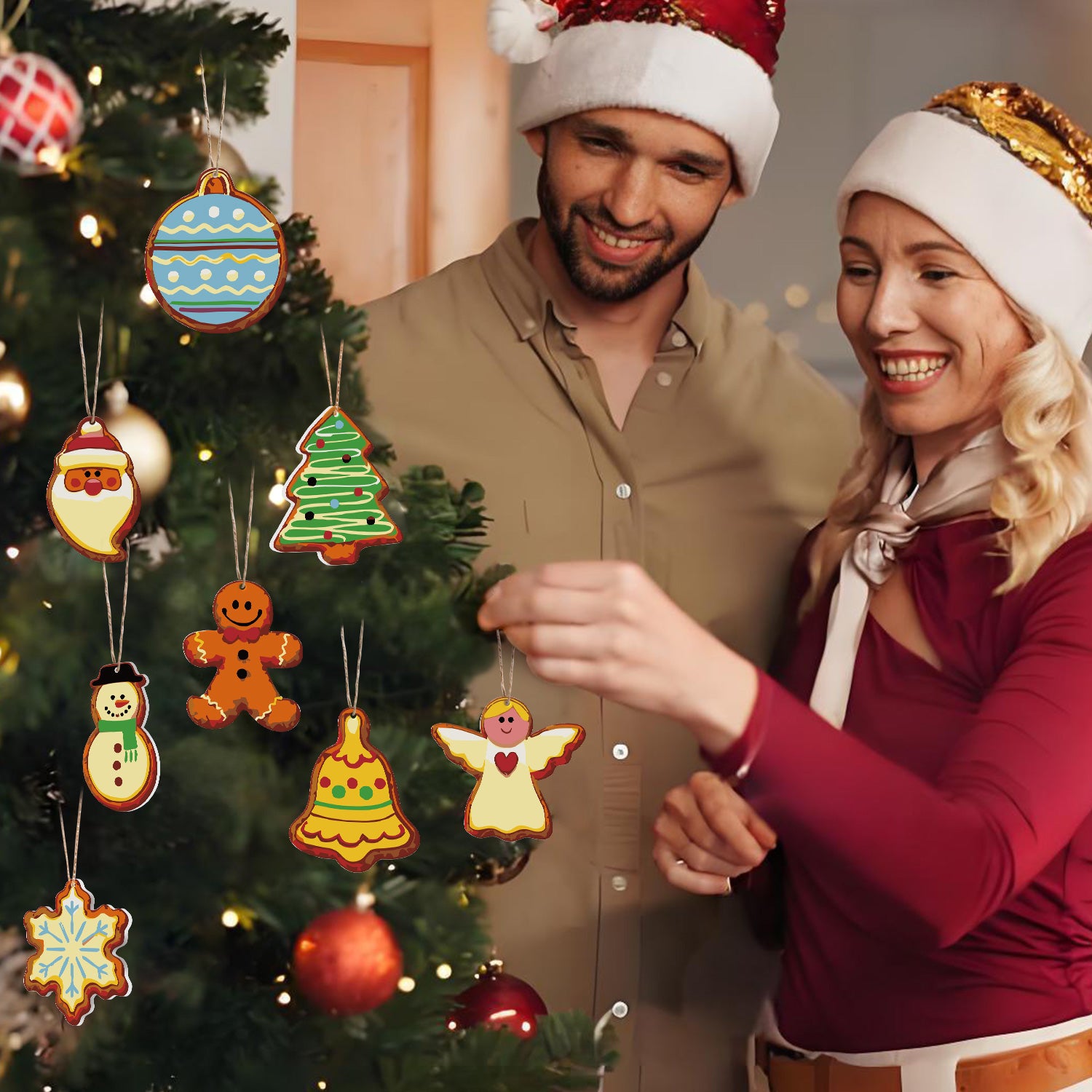 Man and woman wearing Santa hats in front of a Christmas tree with decorative ornaments.