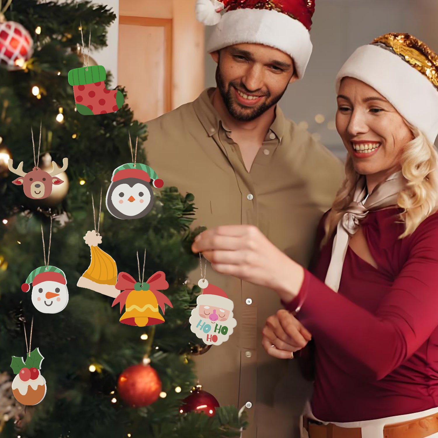 Man and woman in festive attire standing next to a Christmas tree with decorative ornaments.