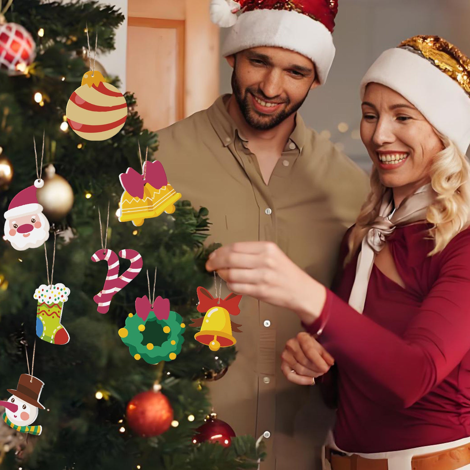 Man and woman in festive hats decorating a Christmas tree with colorful ornaments.