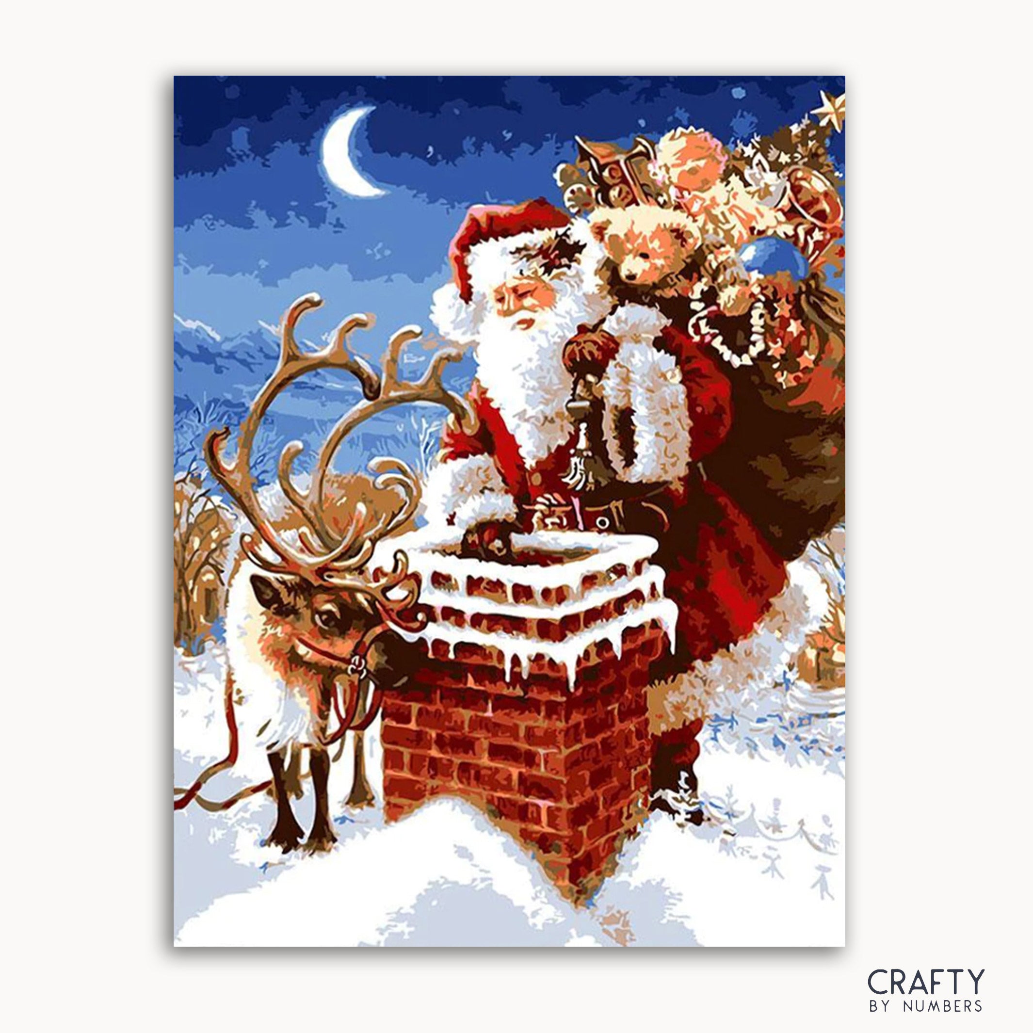 A paint-by-numbers kit depicting a Christmas scene with Santa Claus on a chimney, accompanied by a reindeer, against a moonlit background.