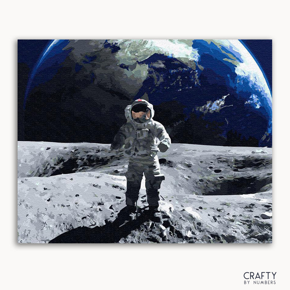 A painting depicting an astronaut standing on the surface of the moon with Earth visible in the background. The artwork is framed.