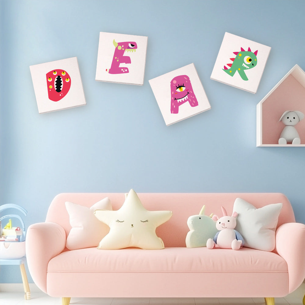 Children's room with pink sofa, colorful cushions, and wall art featuring letters and monsters.