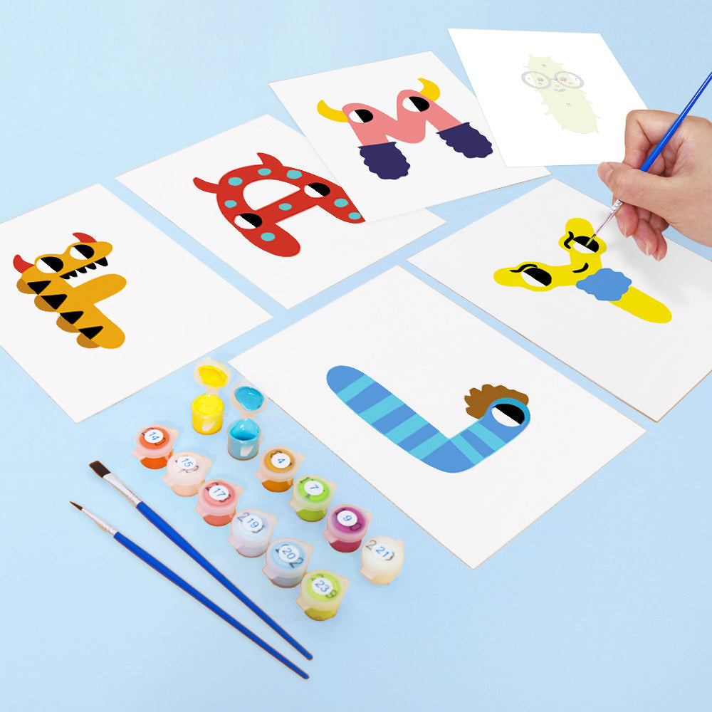 Children's art project with painted letters on paper and paint supplies.