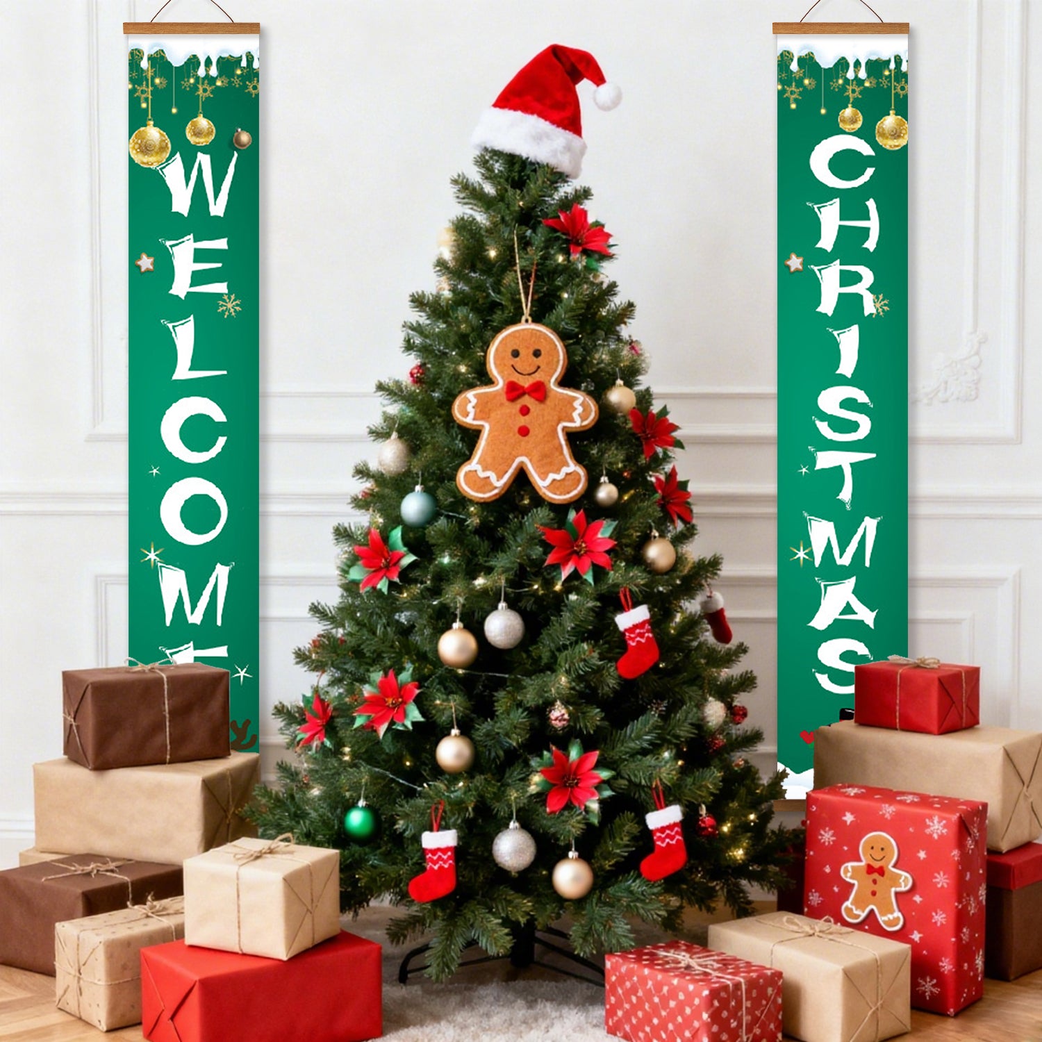 Decorated Christmas tree with gingerbread ornaments, surrounded by wrapped presents, against a white wall with 'Welcome Christmas' banners.