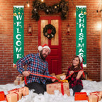 Two people in festive attire sitting on a snowy floor with Christmas decorations and gift boxes.