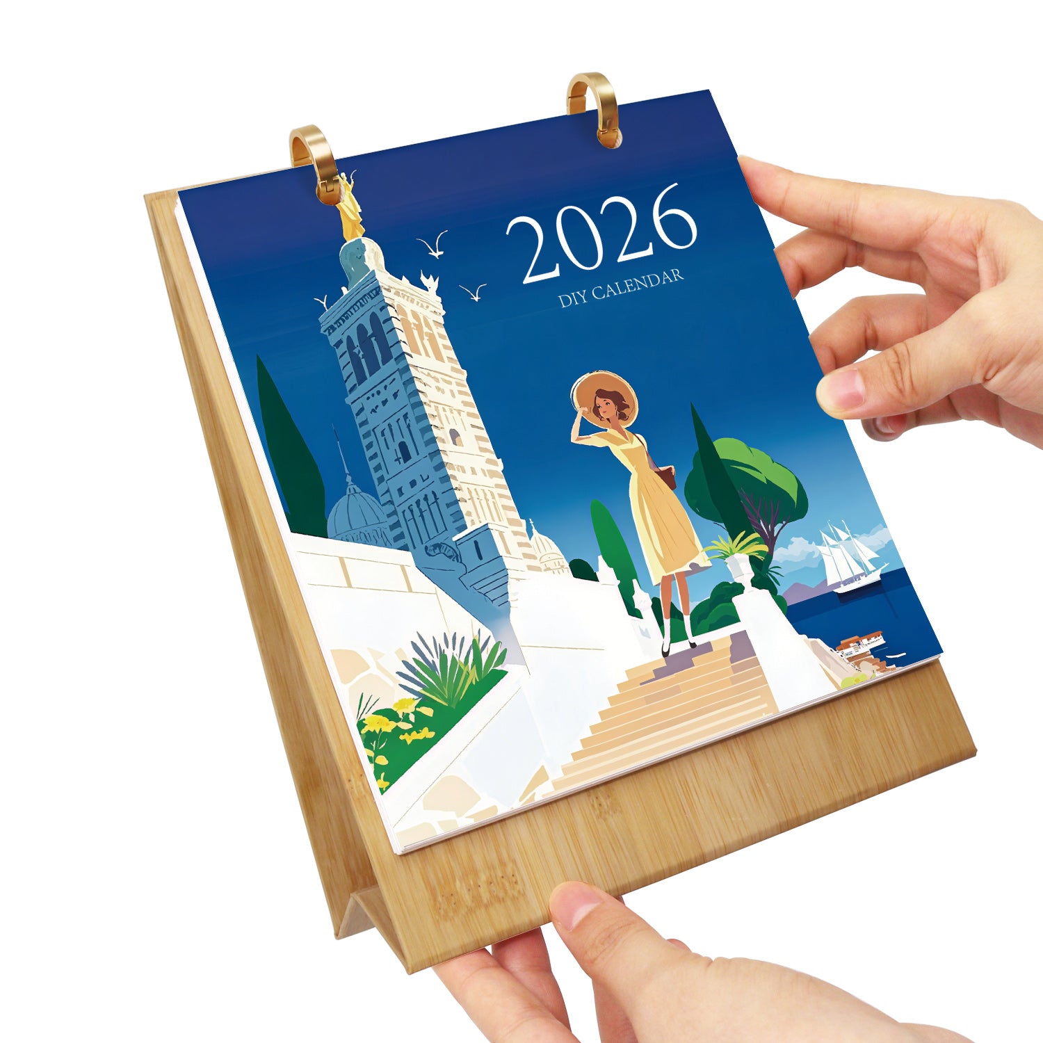 Calendar for 2026 with a design of a woman and a clock tower, held by a hand.