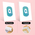 Two cards with a letter 'Q' design, one without a frame and one with a frame, on a pink background.