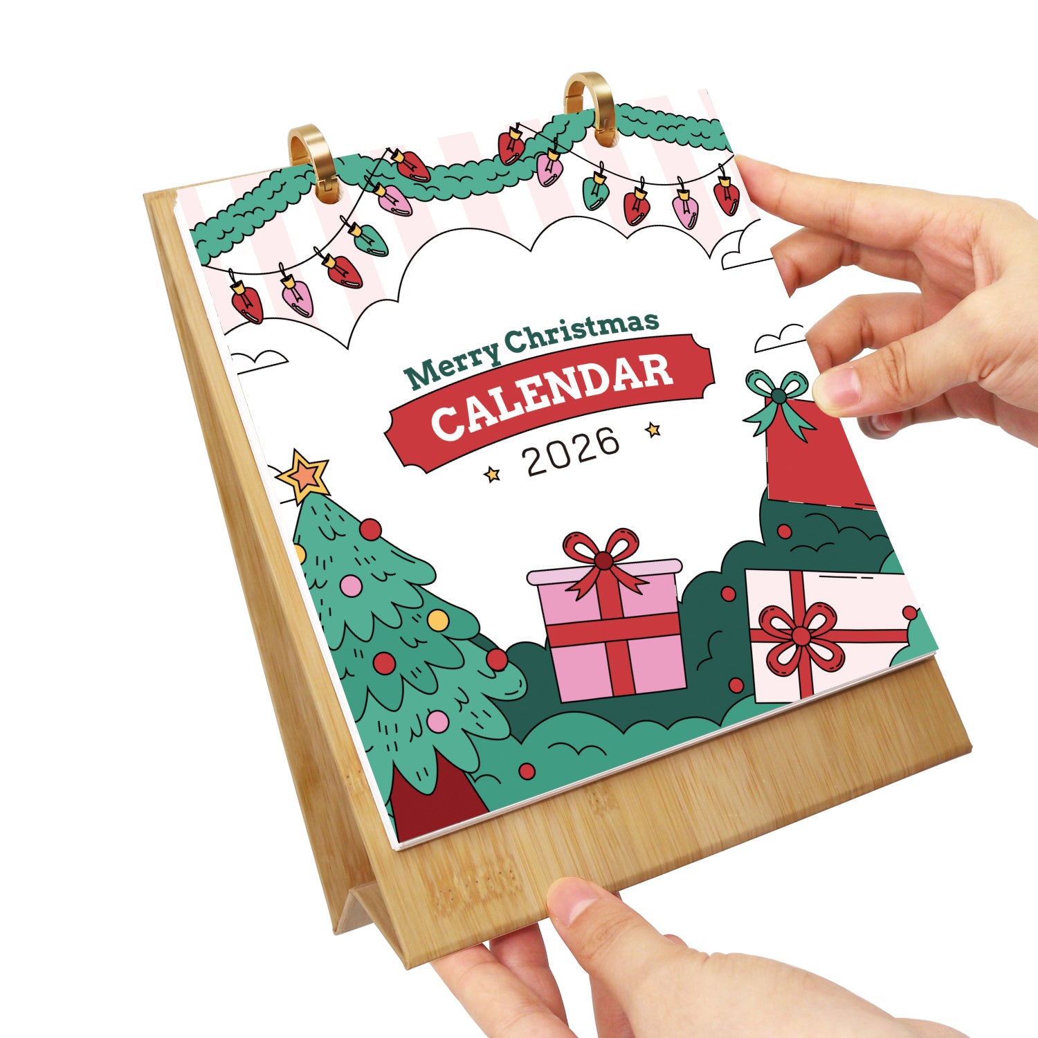 Christmas-themed calendar with festive designs and text, held by a hand on a white background.