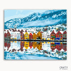 A painting of a vibrant cityscape with colorful buildings lining a waterfront, with mountains in the background.