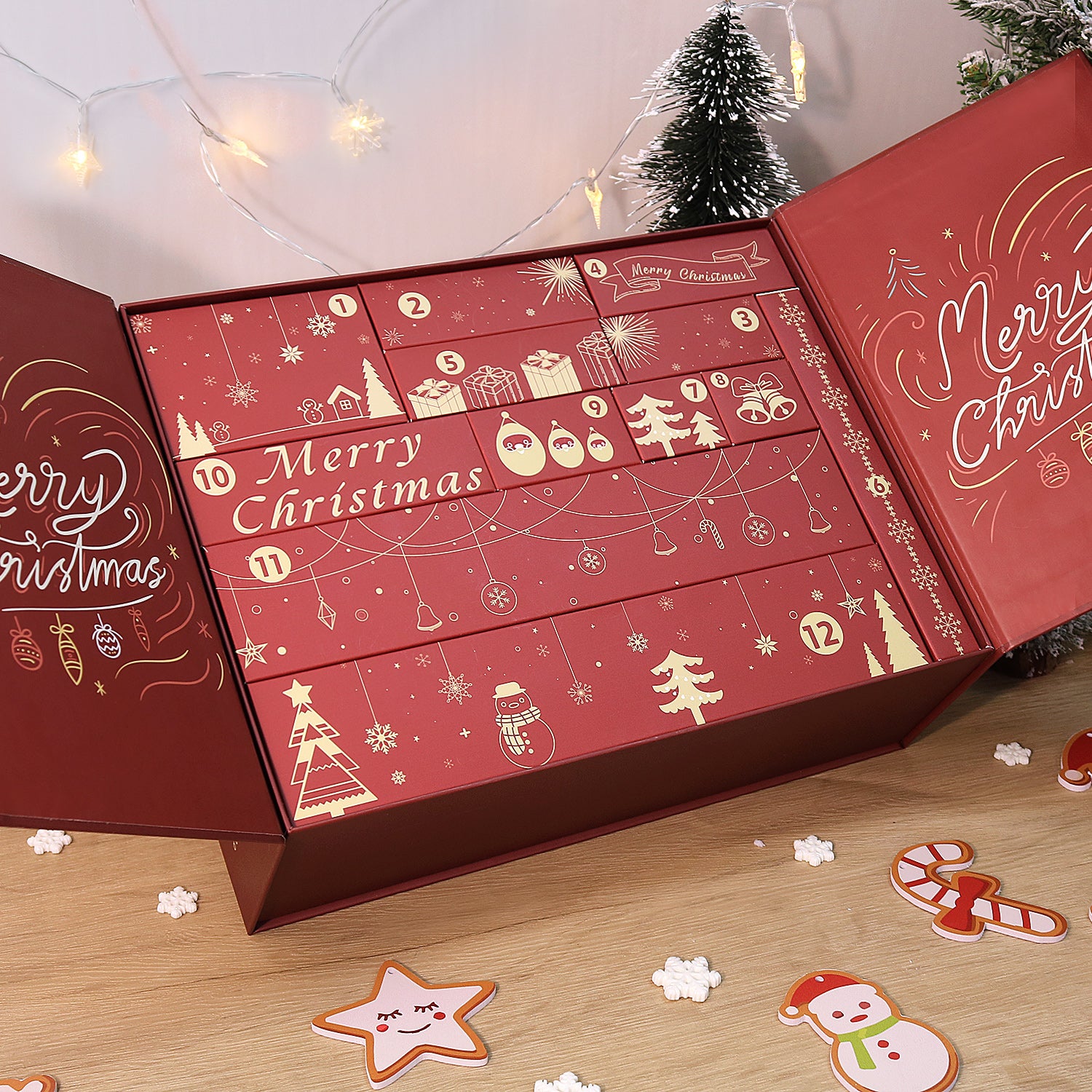Red advent calendar with Christmas-themed designs on a wooden surface.