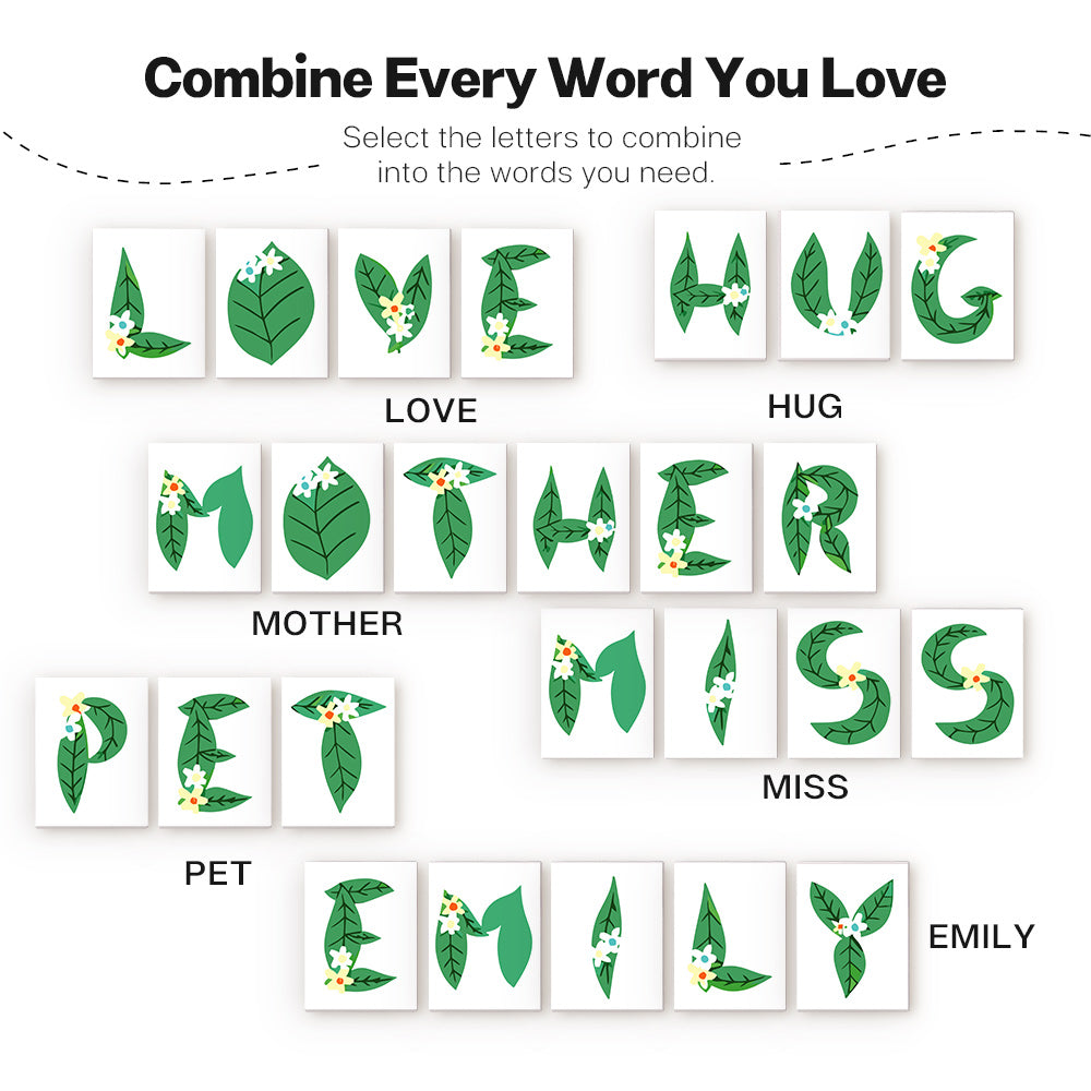 Set of green leaf-shaped letter tiles with floral designs on a white background, arranged to form various words.