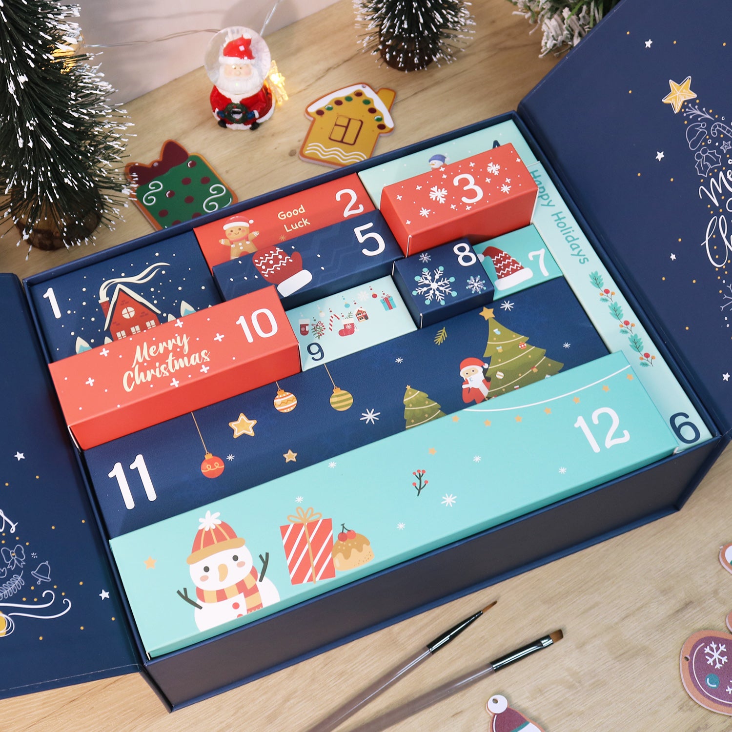 Christmas advent calendar with festive designs on a wooden surface.