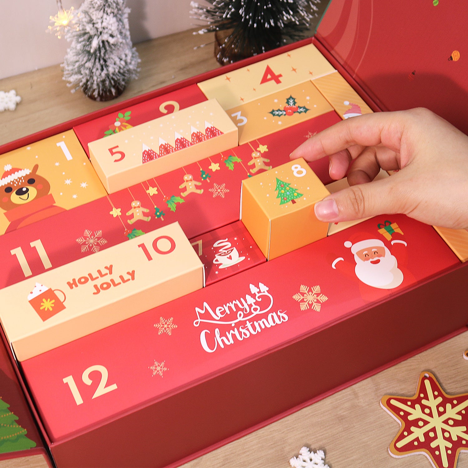 Advent calendar with Christmas-themed design and a hand opening a door.
