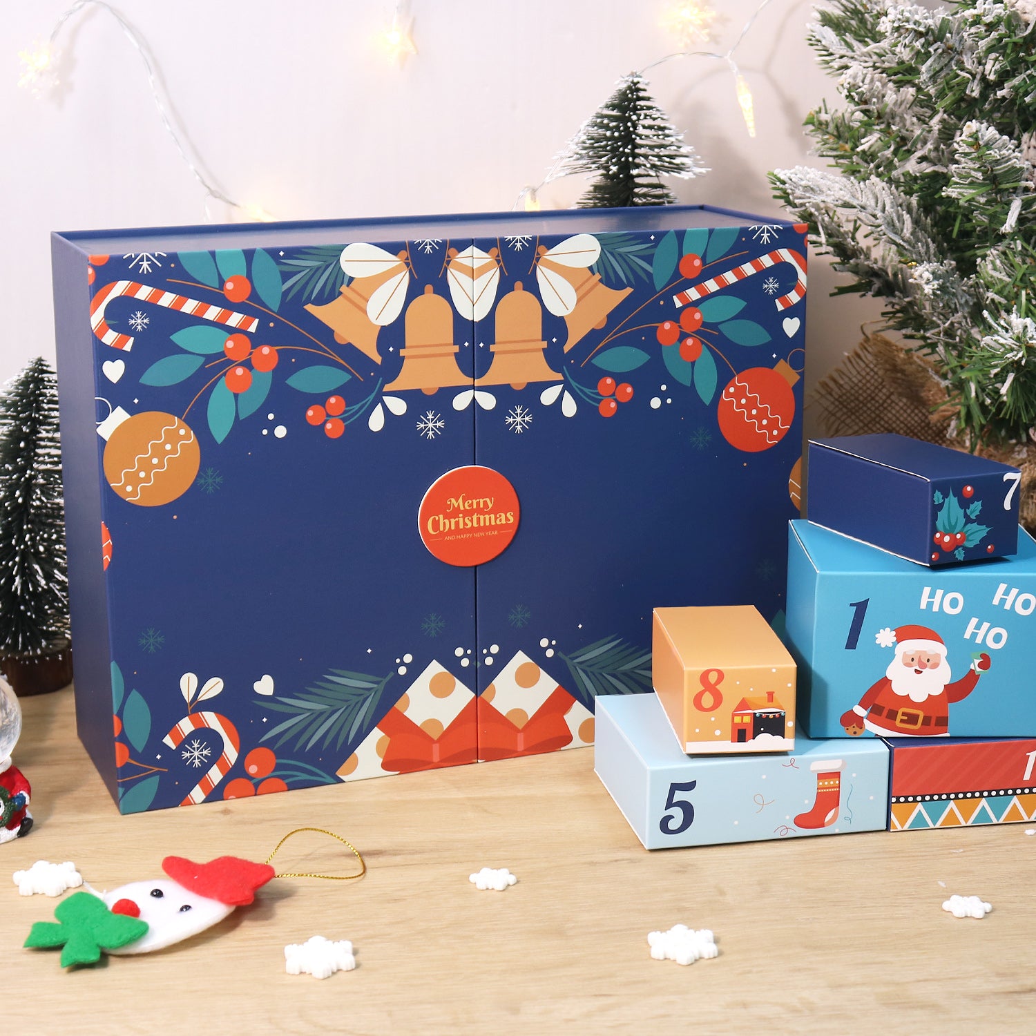 Decorative advent calendar with festive designs on a wooden surface.