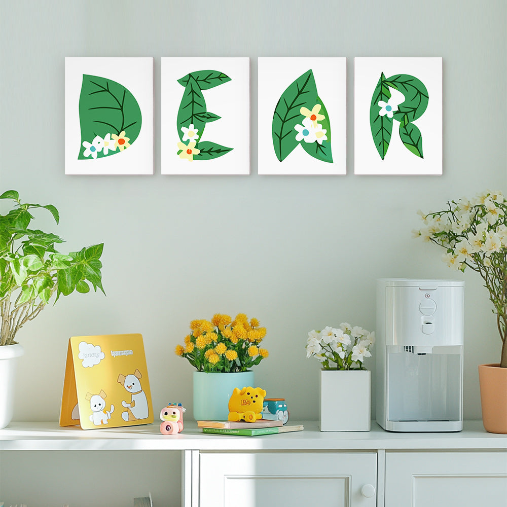 Decorative wall art with leaf designs on a light green wall.
