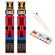 Two nutcracker-themed vertical banners with paintbrushes and paint tubes on a white background